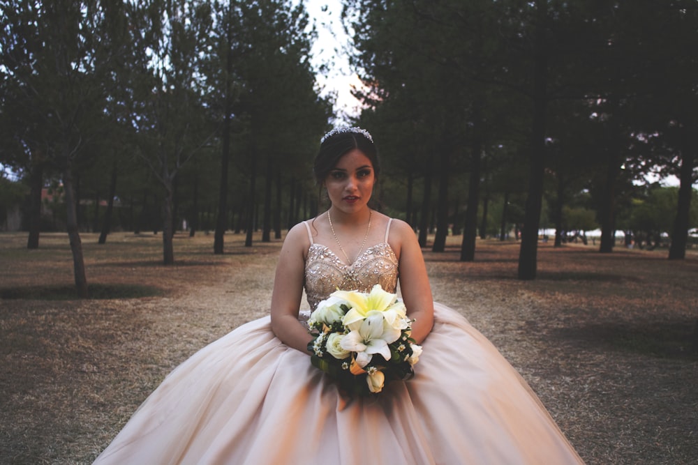 woman wearing brown floral wedding gown