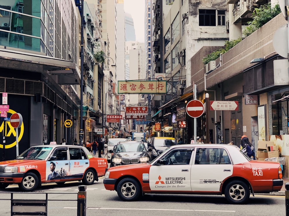 cars running on road during daytime