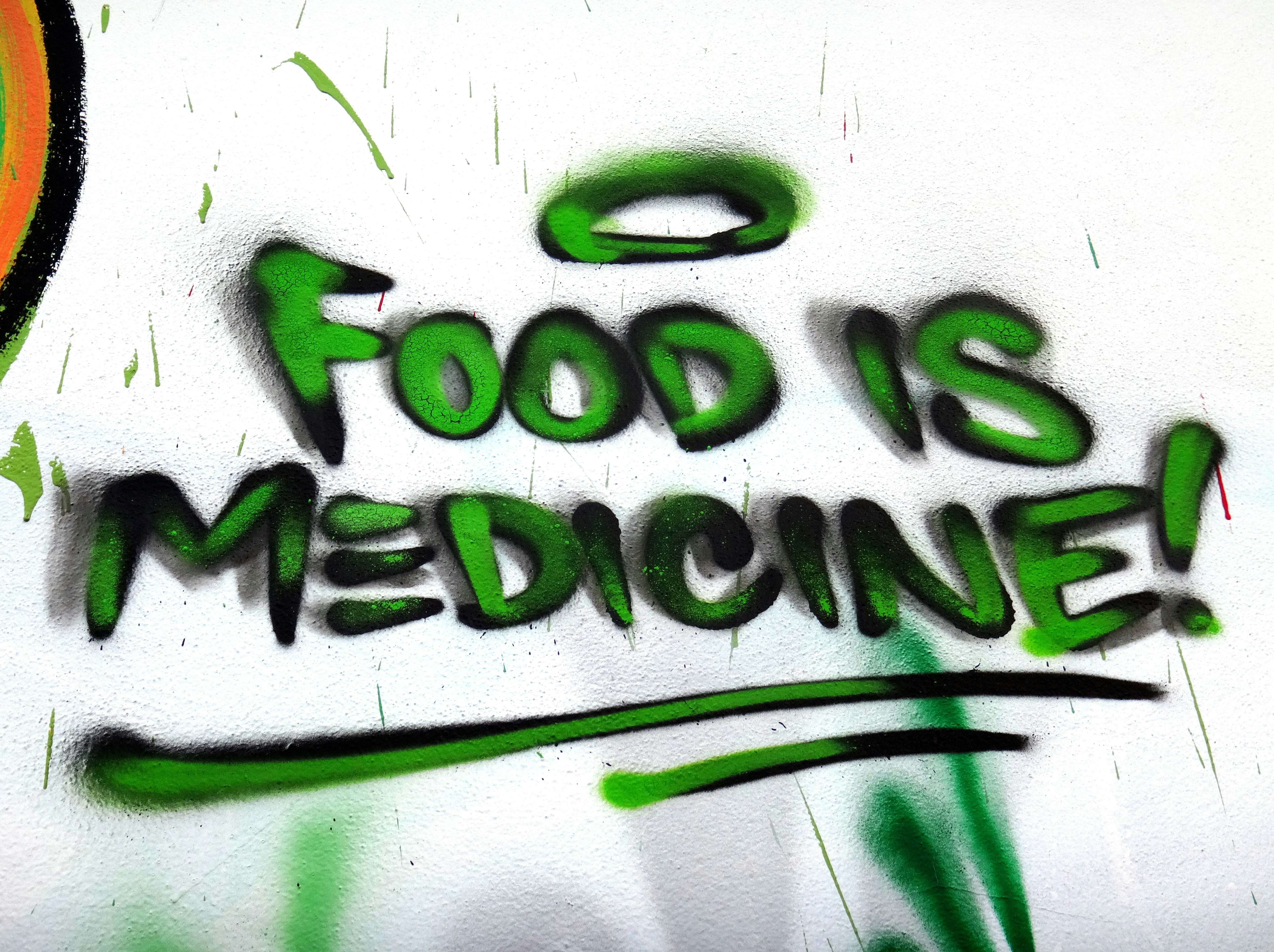This is park of a larger mural that is very difficult to get a photo of because of the street sign and electric pole in the way. This mural continues to show and the benefits of farm fresh foods and the influence of the pharmacological system on the medical community. A lot of Propaganda.