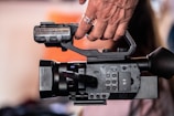 A close-up of a camera capturing a dynamic video shoot.
