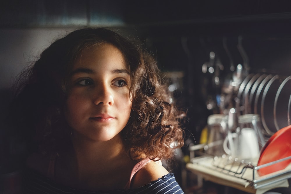 girl near kitchen rack