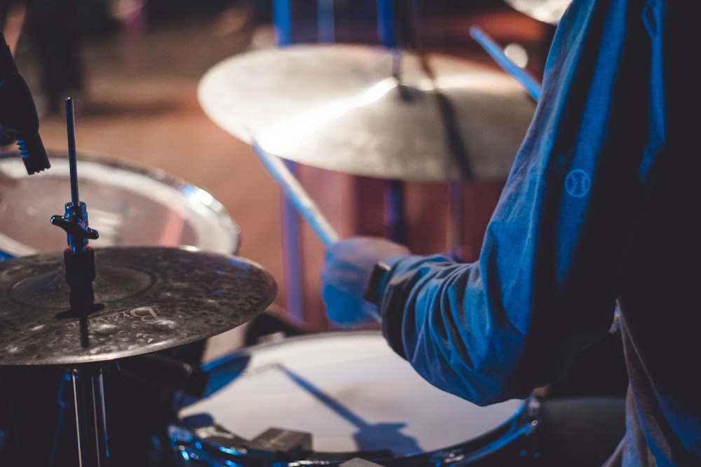 man holding drum stick