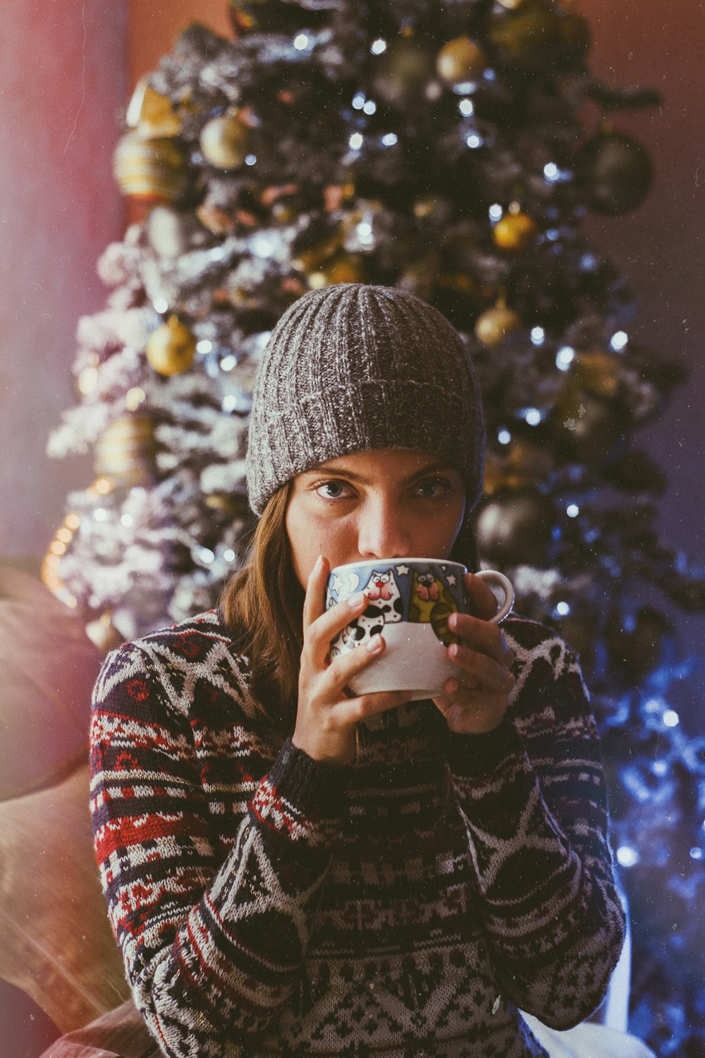 woman holding ceramic mug