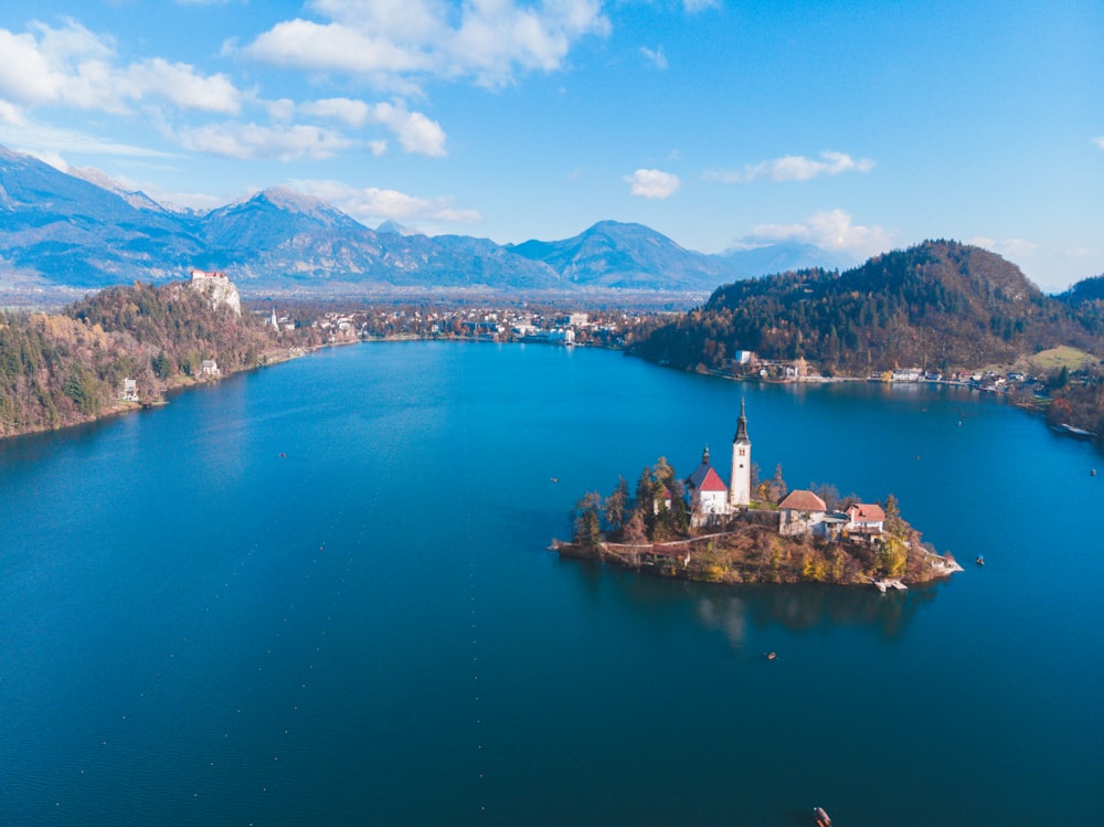 islet with house beside mountain