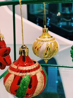 A collection of mid-century inspired ornaments arranged on a vintage fabric background with subtle textures.