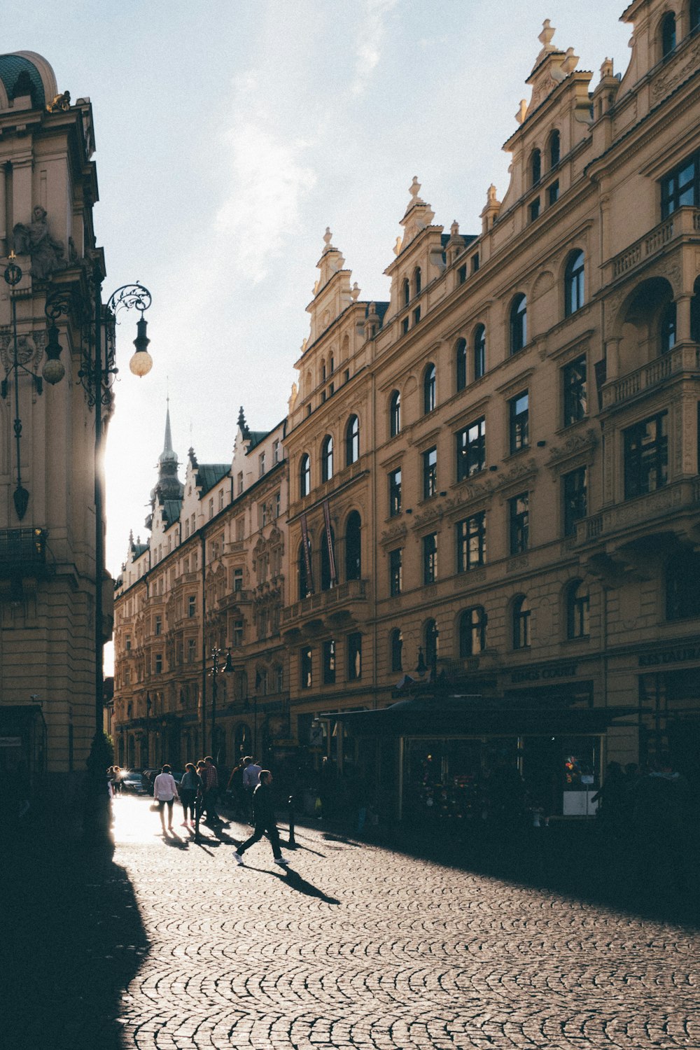 people walking near brown building during daytime