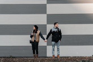 man and woman holding each other's hands