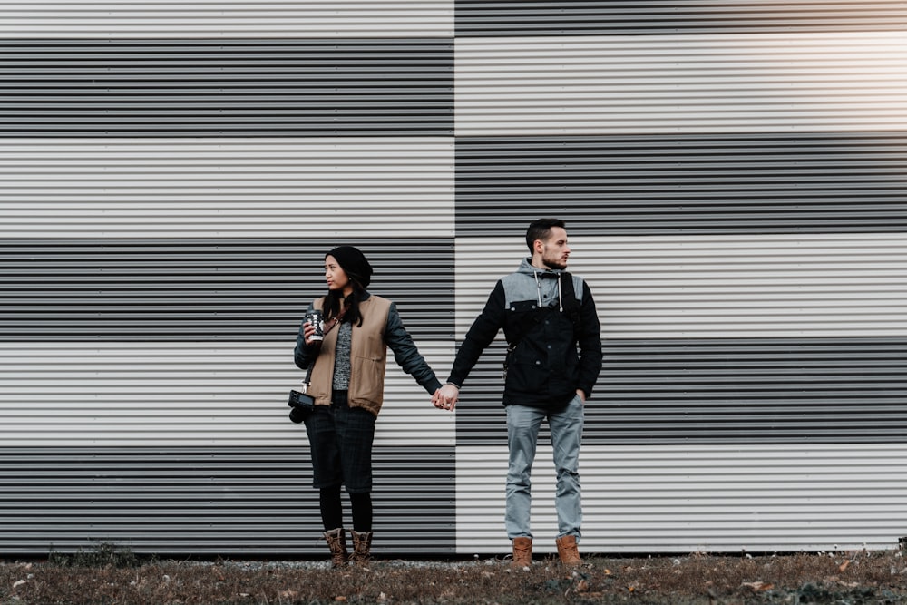 man and woman holding each other's hands