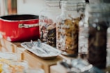 An elegant display of cookie jars on a wooden table.