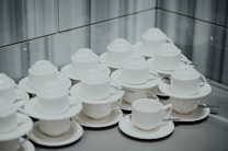 stack of mugs and saucers
