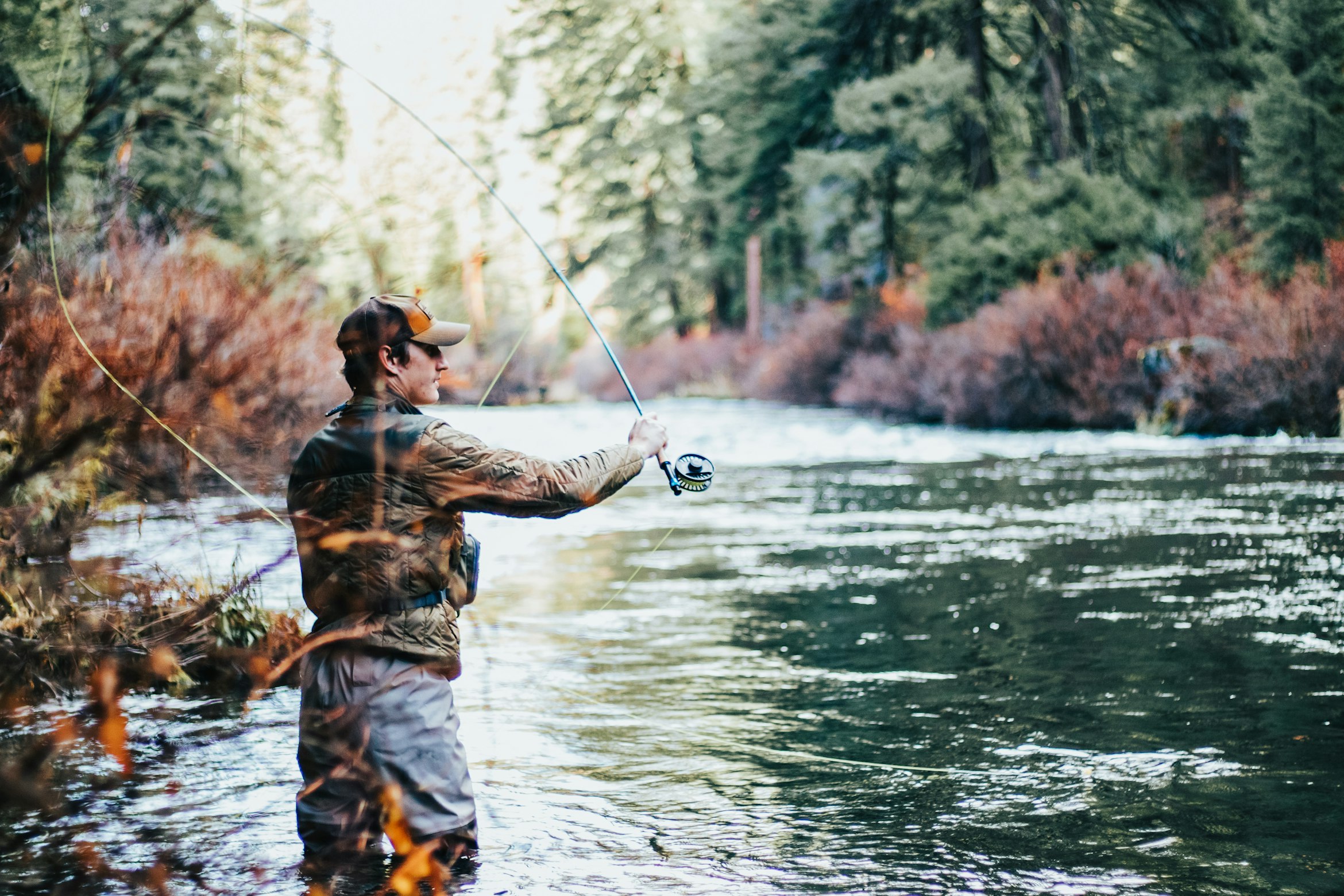 Angler holding a large brown trout
