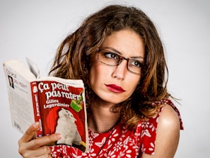 Photo of Maud Brunaud signing books at a cozy literary event.