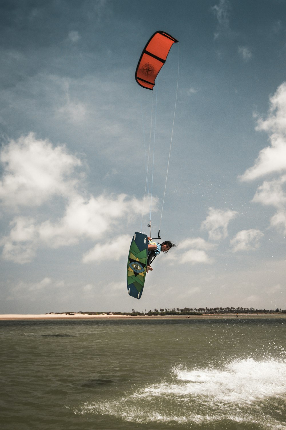 person doing wake boarding during daytime