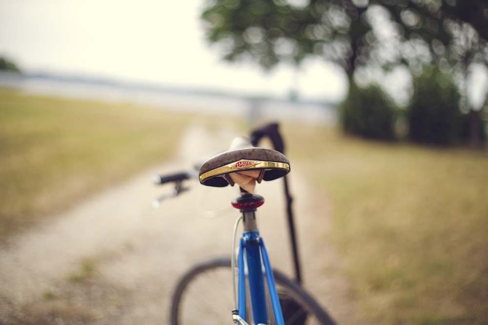 blue bike in selective focus photography