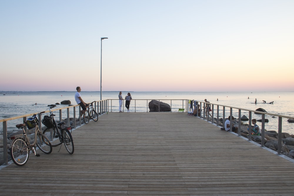 people standing near bay