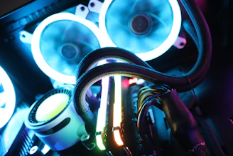 Close-up of a high-performance computer tower with cooling fans and cables.