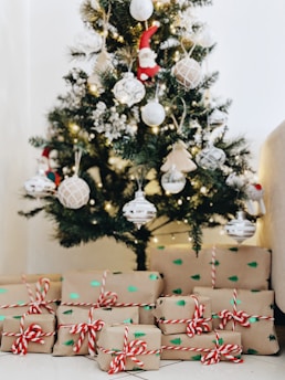 bundle of gifts near Christmas tree