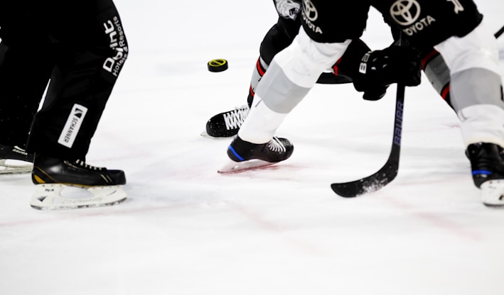 people playing ice hockey