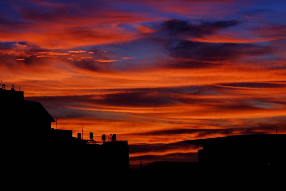 silhouette photography of buildings during sunset