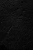 a black and white photo of water and sand