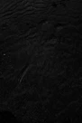 a black and white photo of water and sand