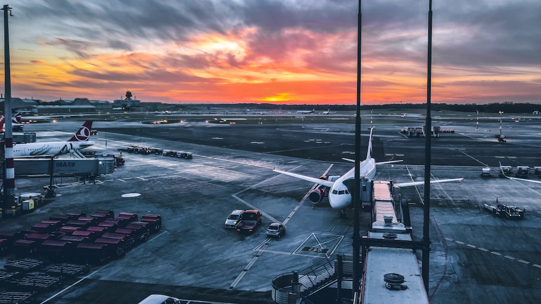 a large jetliner sitting on top of an airport tarmac,