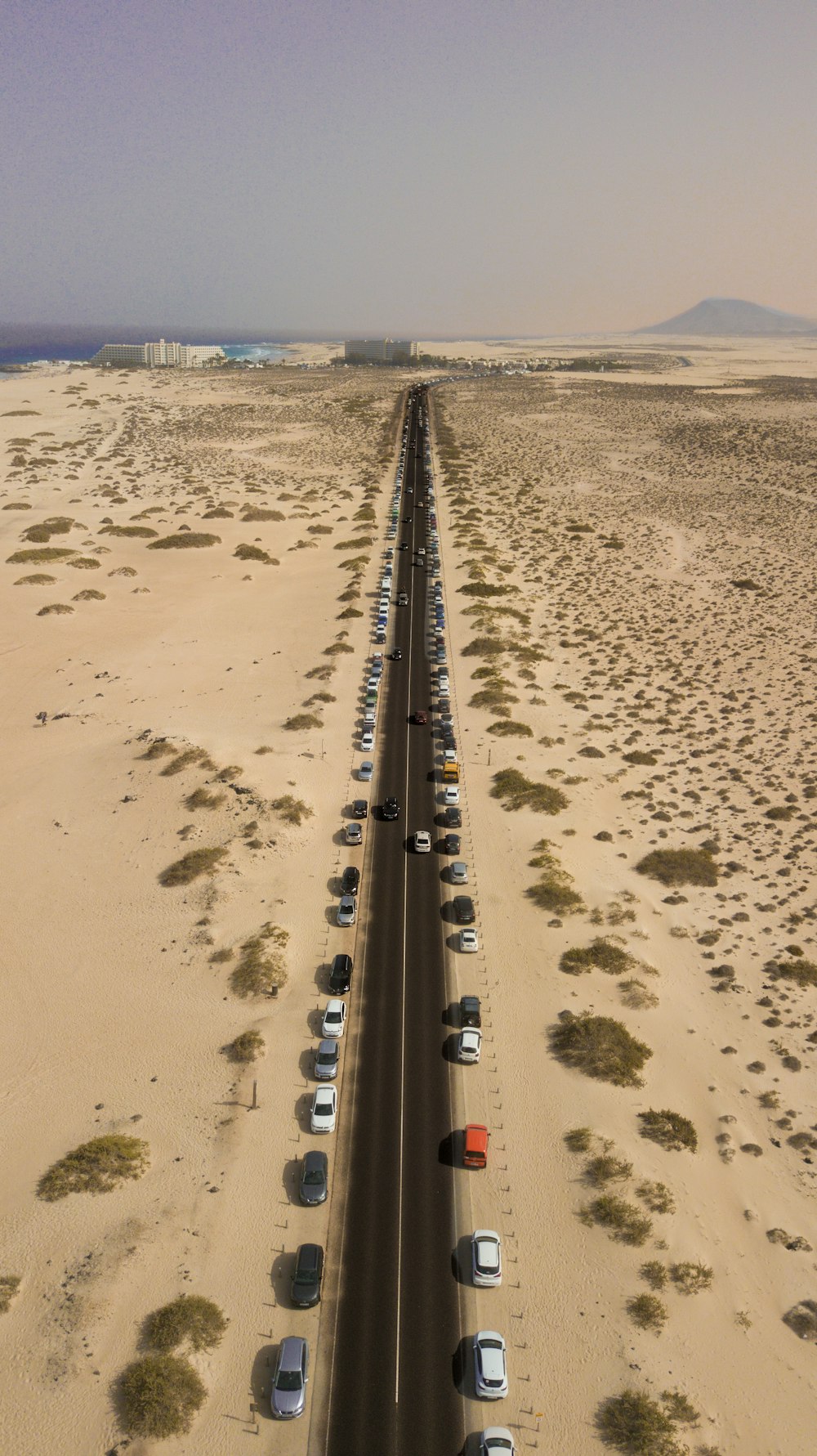 cars parked beside road during daytime