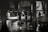 A black and white scene depicting several workers in activity, possibly in a market setting. The workers are standing around tables filled with ice, engaging in what appears to be the preparation or selling of goods. The environment is under a sheltered area with pillars, and the ground appears wet, reflecting the surrounding structures.