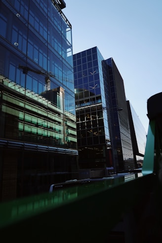 Close-up of a sleek, modern glass with urban skyline reflections.