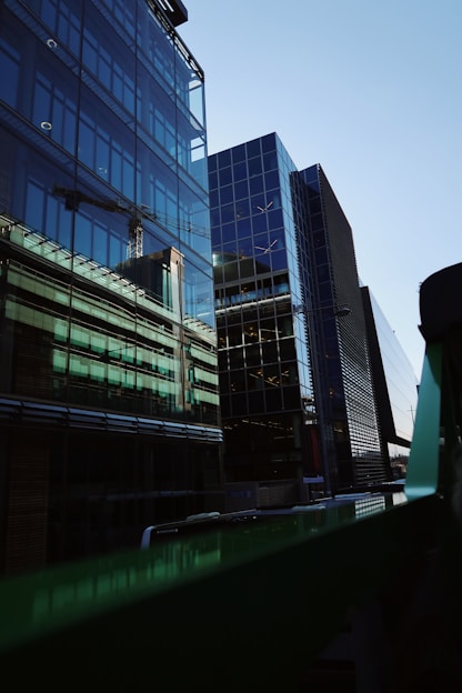 Close-up of a sleek, modern glass with urban skyline reflections.