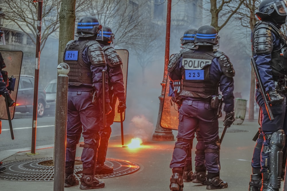 group of police men walking on street