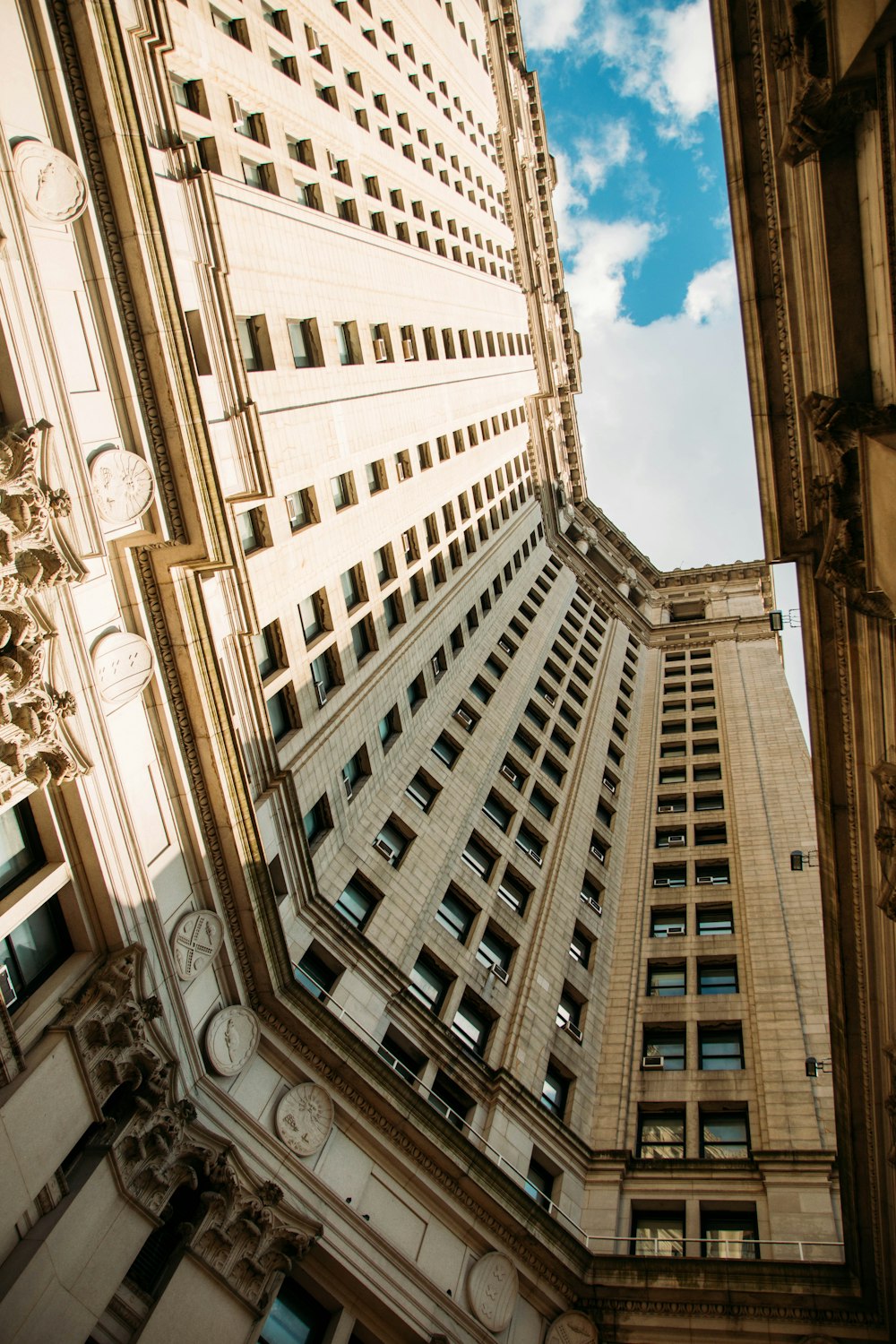 low angle photography of white high rise building