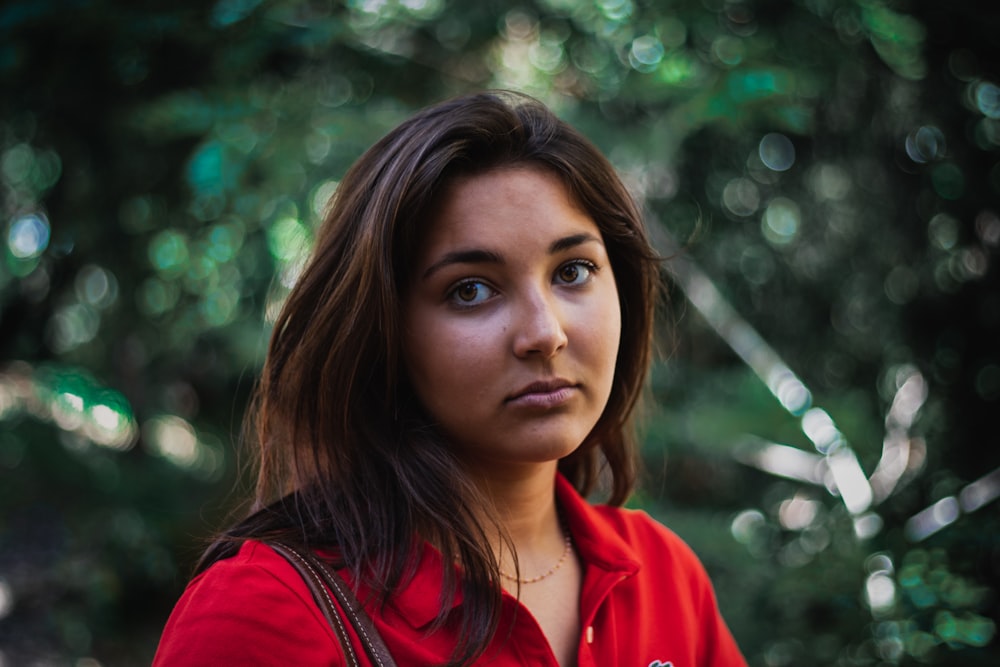 woman in red collared shirt