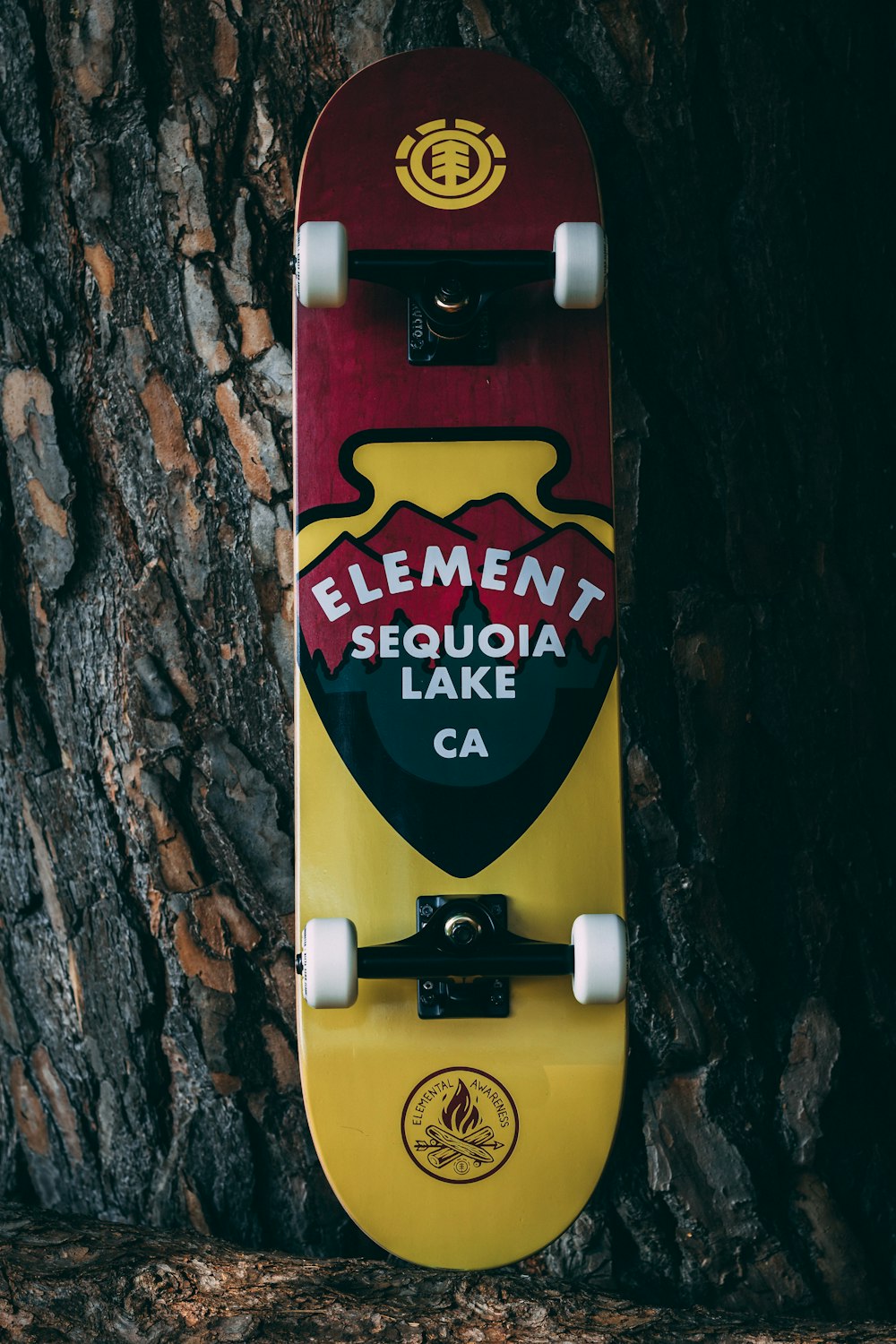 red and yellow Element Sequoia Lake Ca-printed skateboard