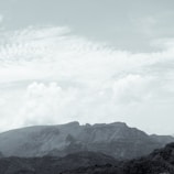 A calming landscape of gentle hills and soft clouds, evoking peace.