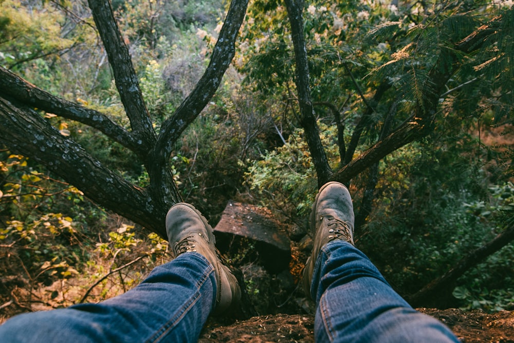 man sitting on brown soil