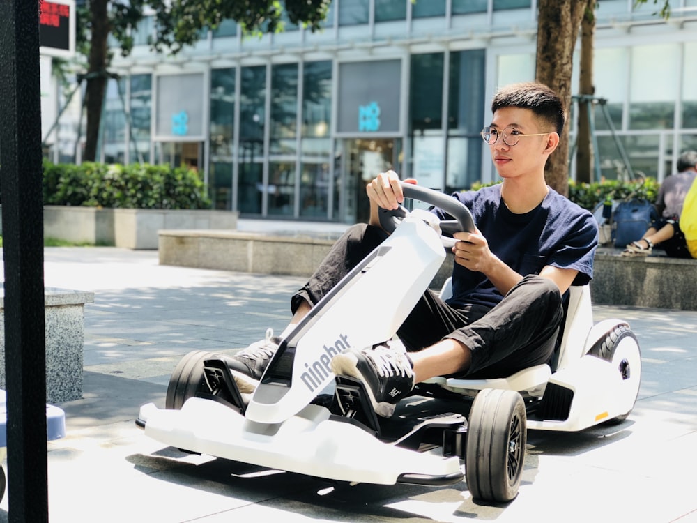 man riding on Segway Ninebot GoKart during daytime