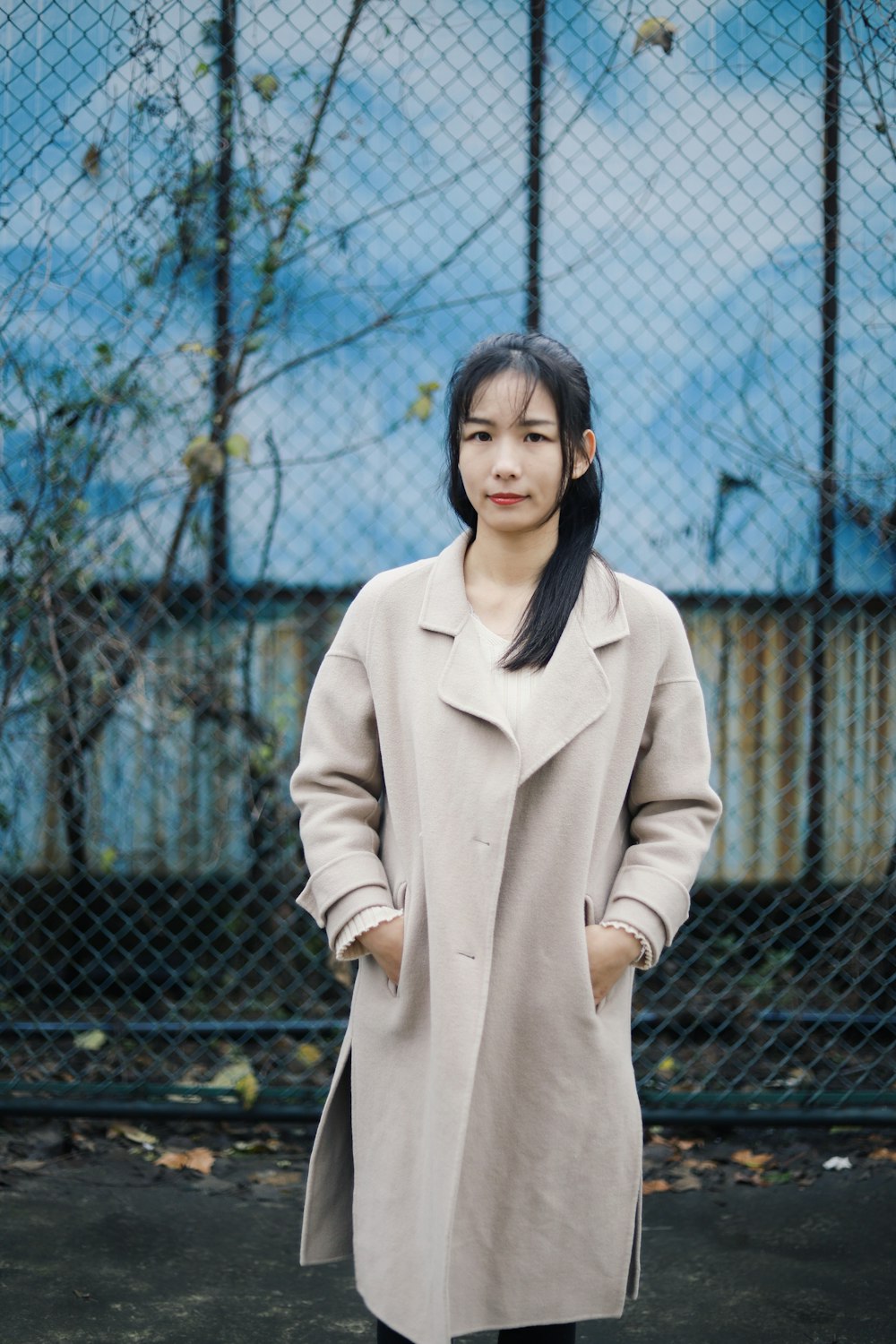 woman wearing brown coat