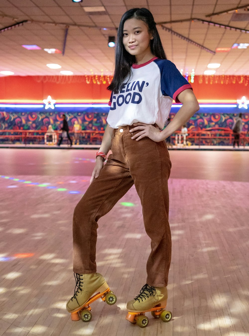 standing woman using roller skates inside building