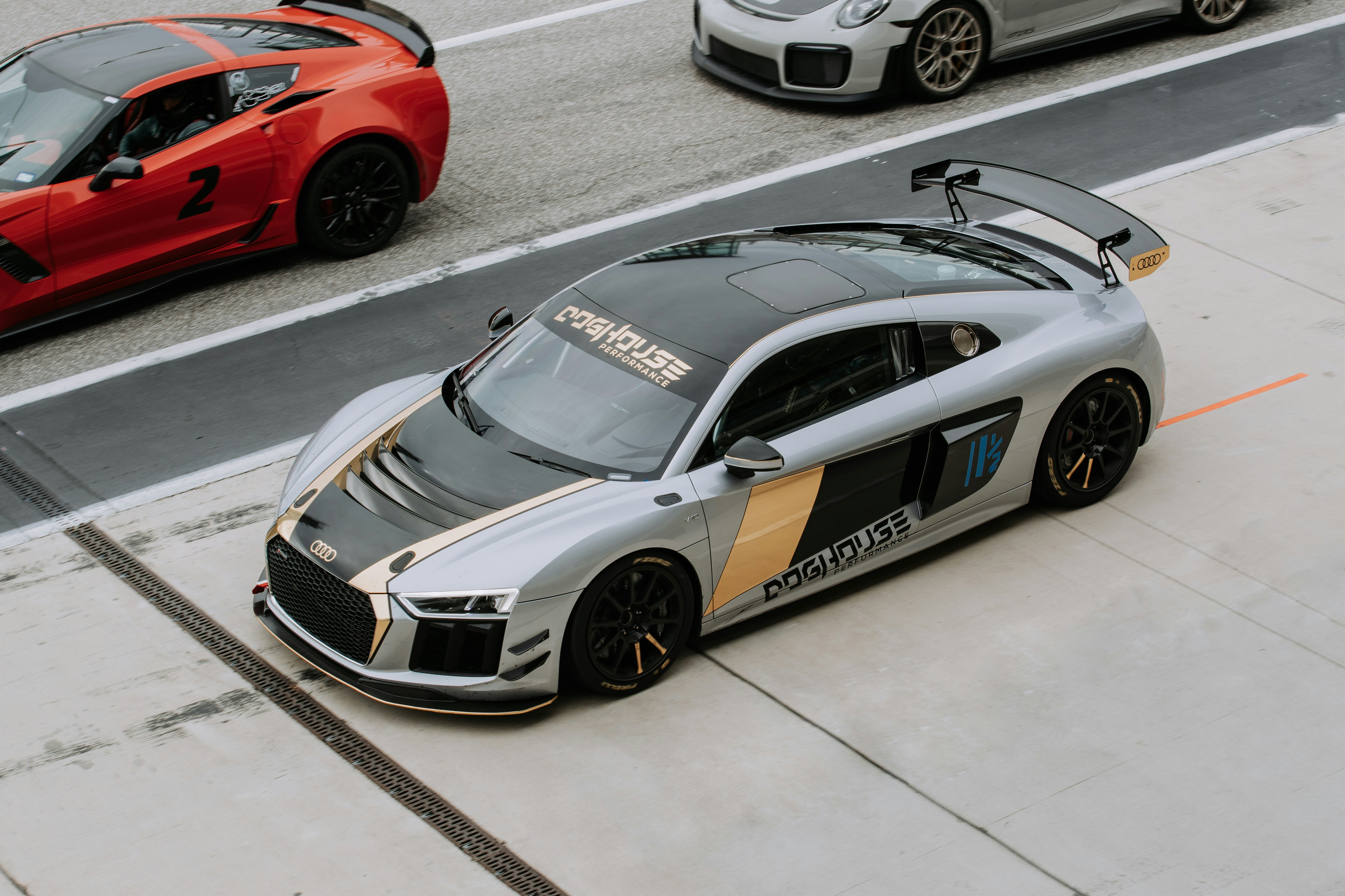 gray and black Audi R8 coupe on asphalt road during daytime