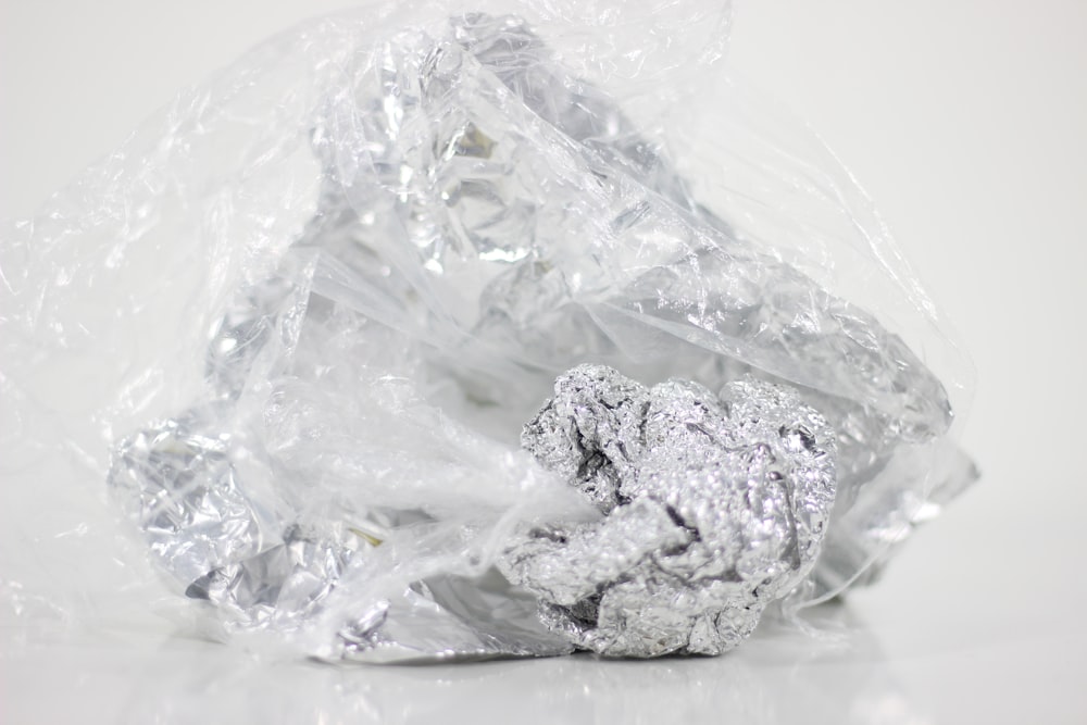 silver-colored stone in plastic pack