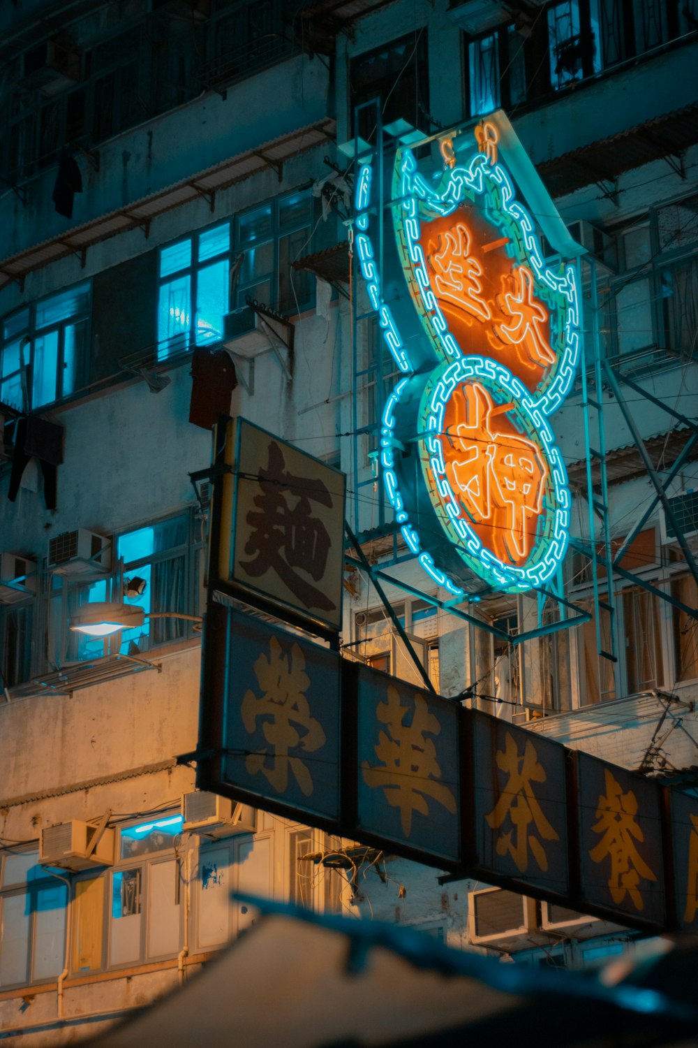 green and orange kanji LED sign