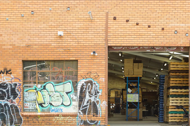 A vibrant, freshly painted warehouse wall reflecting the company's commitment to quality finishes.