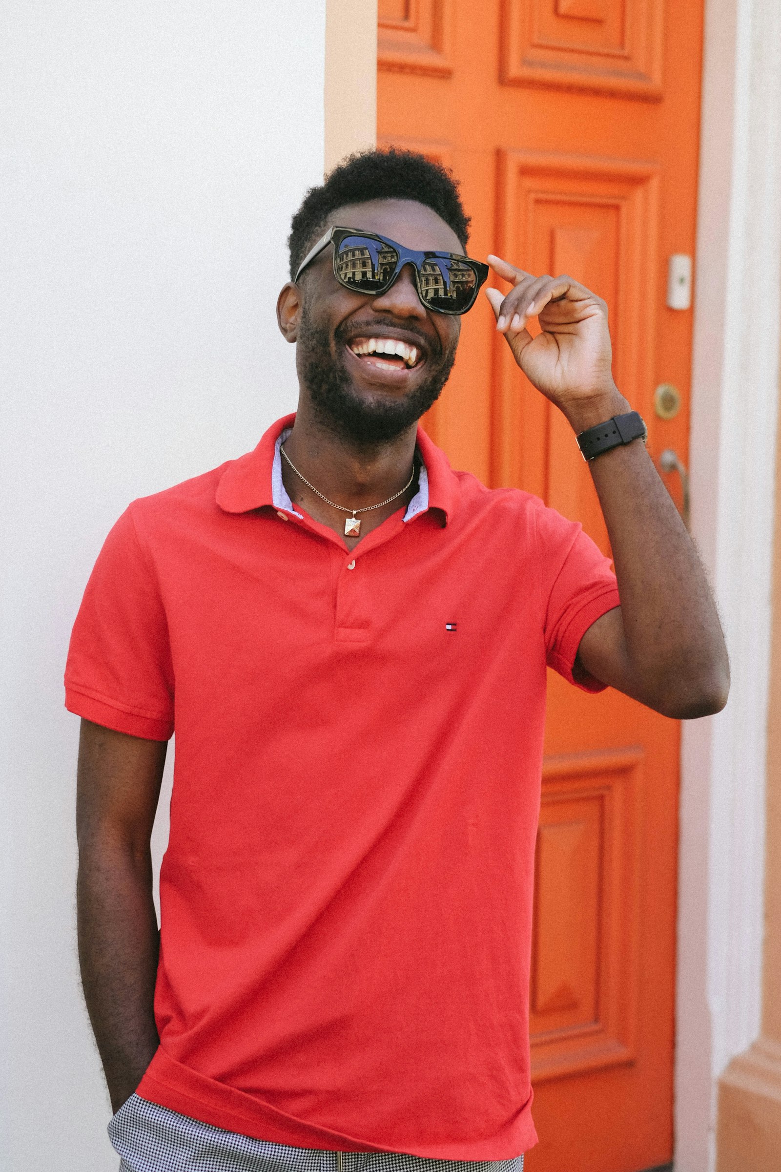 Fujifilm X-E3 + Fujifilm XF 35mm F1.4 R sample photo. Smiling man wearing red photography