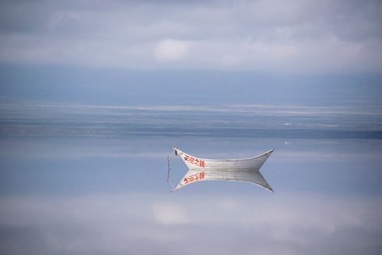 grey boat in Chaka Salt Lake China