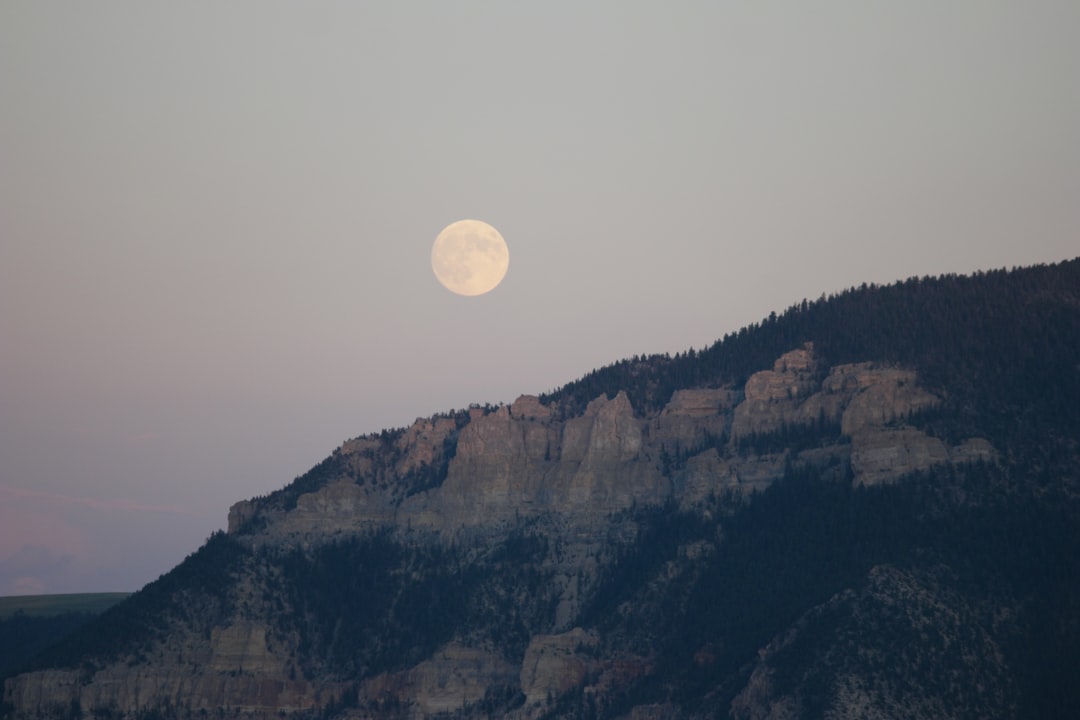 gray mountain under round moon