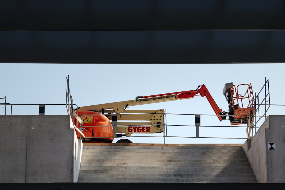 orange and white Gyger heavy equipment lifting