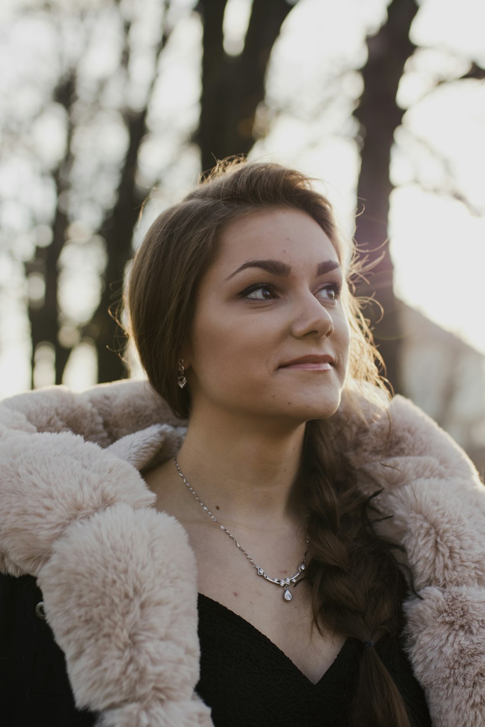 woman wearing white fur coat