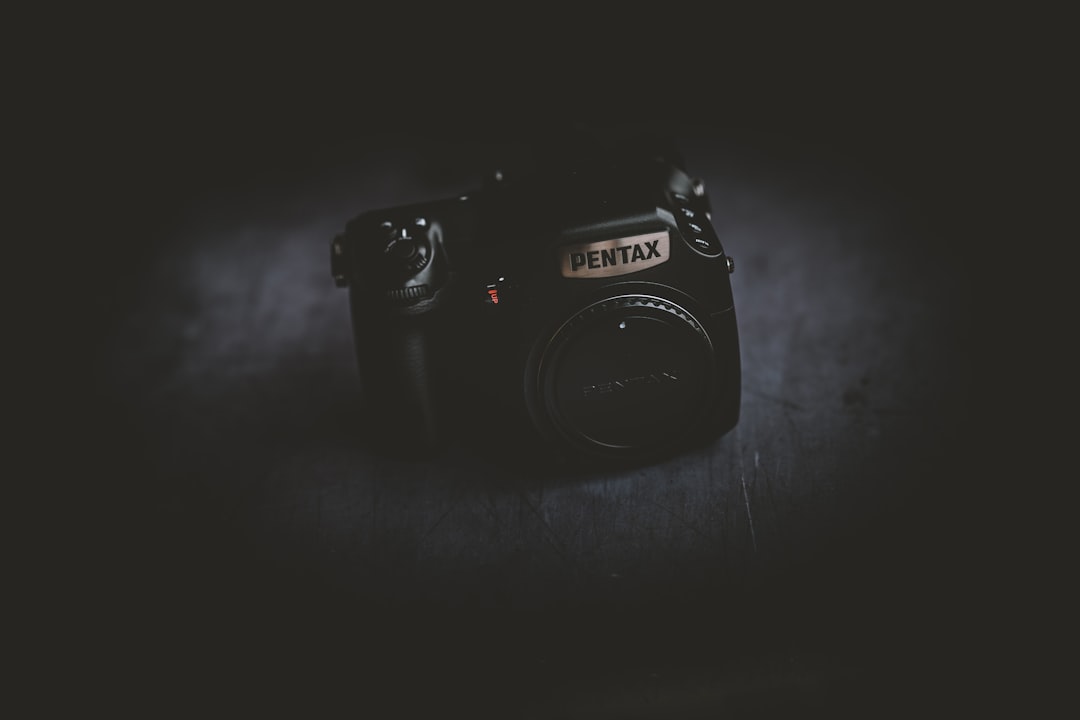 black Pentax camera,