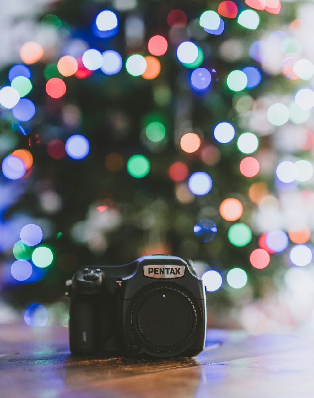 selective focus photography of black Pentax bridge camera